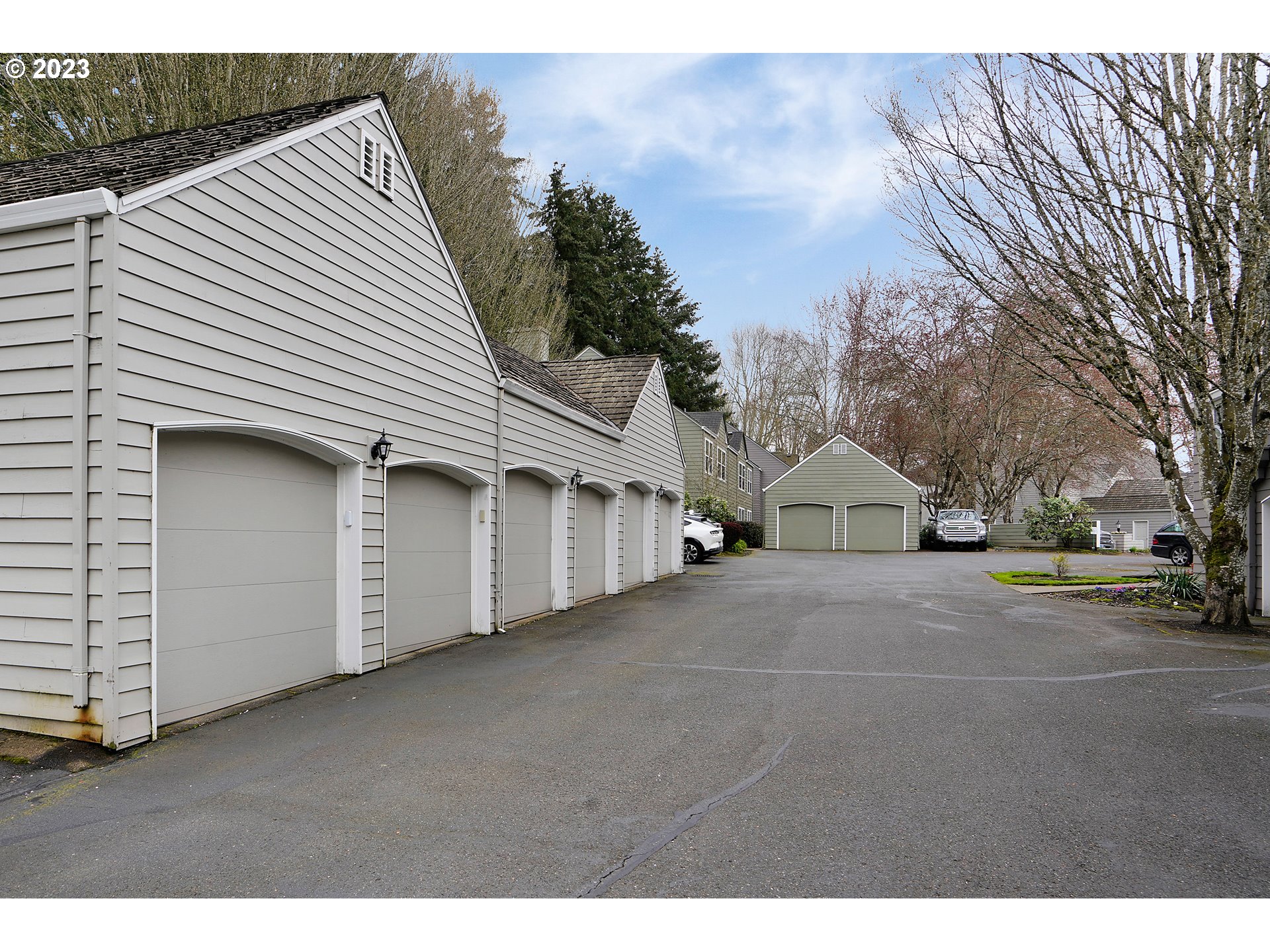 8415 Southwest Curry Drive, Unit A Wilsonville, OR 97070 - Photo 34 of 36 a view of a house with a yard and garage