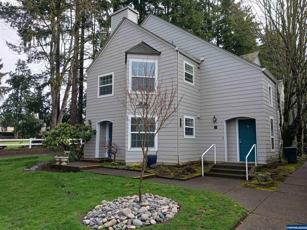 8415 Southwest Curry Drive, Unit A Wilsonville, OR 97070 - Photo 36 of 36 a front view of a house with a garden