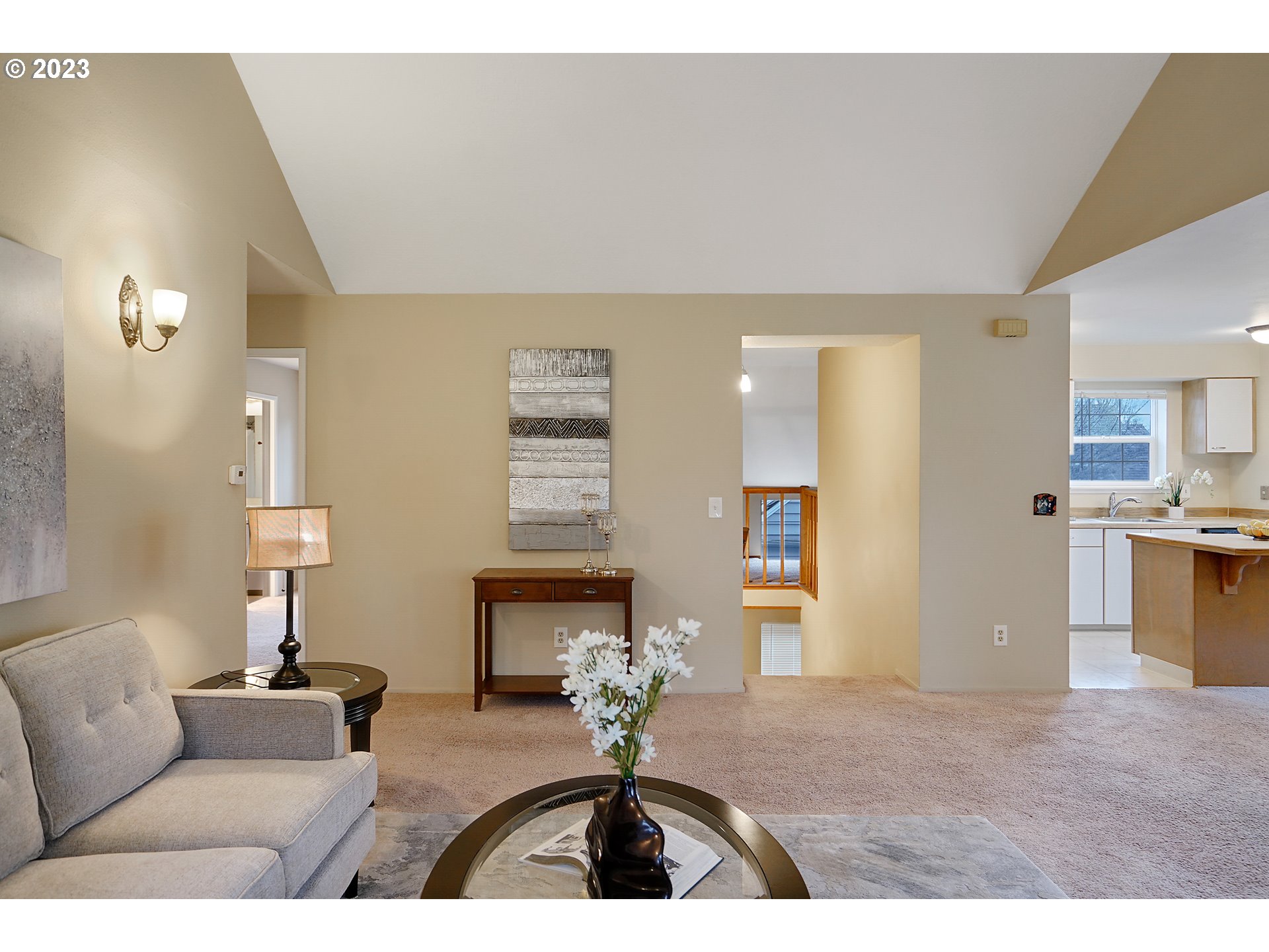 8415 Southwest Curry Drive, Unit A Wilsonville, OR 97070 - Photo 9 of 36 a living room with furniture and a chandelier