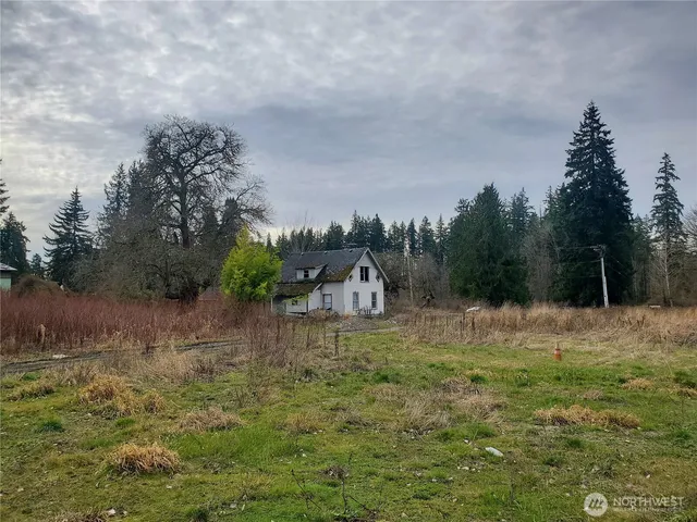 a backyard of a house with lots of green space