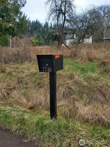 a view of a street with an ocean view