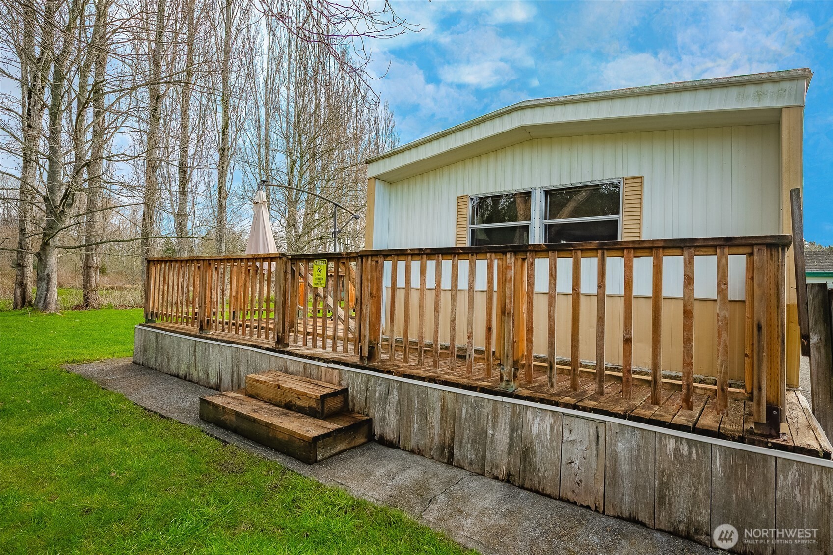 5178 Anderson Road Blaine, WA 98230 - Photo 24 of 37 a view of backyard with deck and a garden