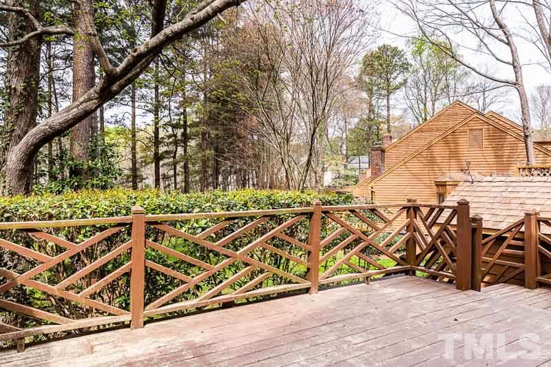 7643 Trowbridge Court Raleigh, NC 27613 - Photo 11 of 26 a view of outdoor space with seating area and trees