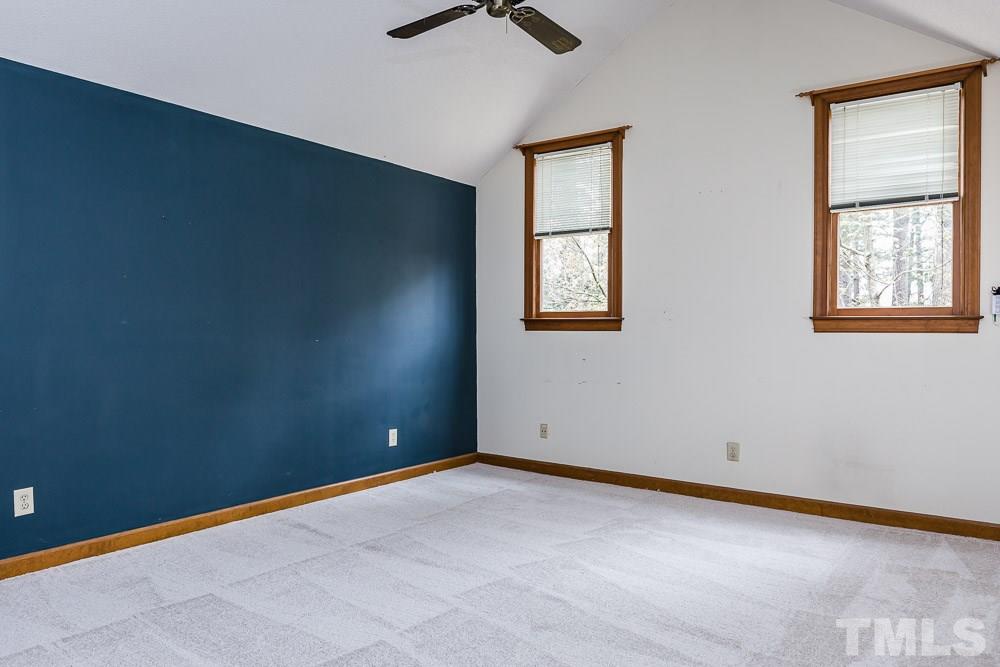 7643 Trowbridge Court Raleigh, NC 27613 - Photo 20 of 26 an empty room with windows and fan