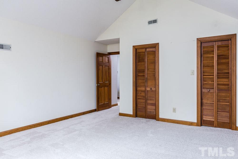 7643 Trowbridge Court Raleigh, NC 27613 - Photo 21 of 26 an empty room with closet