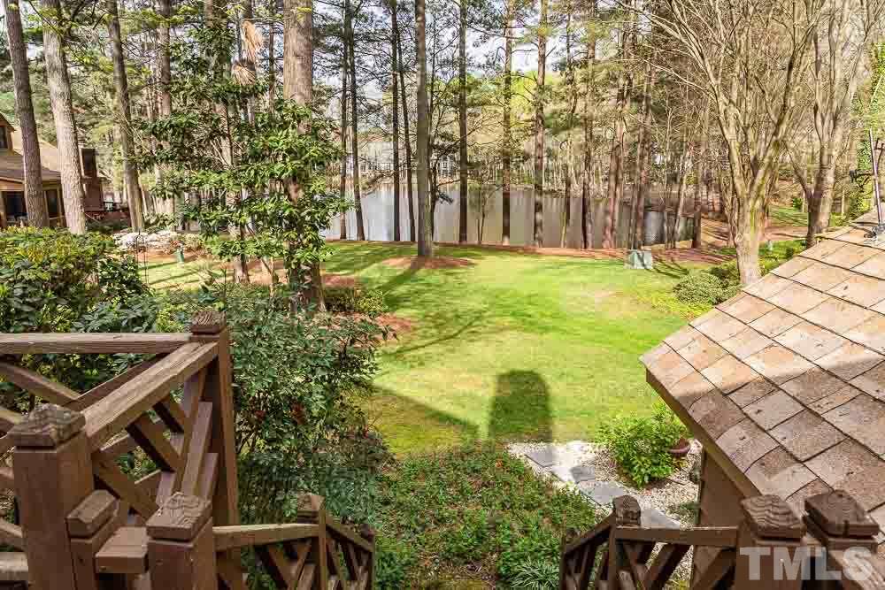 7643 Trowbridge Court Raleigh, NC 27613 - Photo 25 of 26 a view of swimming pool with lawn chairs and plants