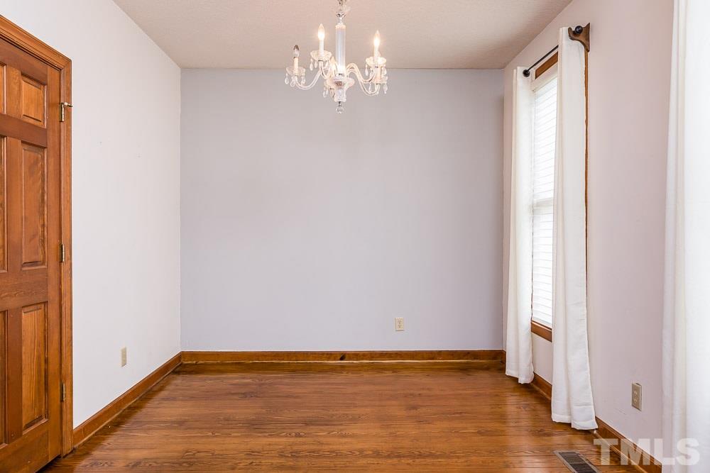 7643 Trowbridge Court Raleigh, NC 27613 - Photo 6 of 26 a view of an empty room with a window