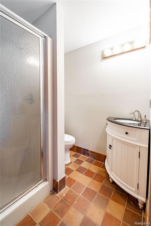 19130 Meridian Road Grosse Ile, MI 48138 - Photo 25 of 49 Full bathroom off the pool with new toilet and vanity.