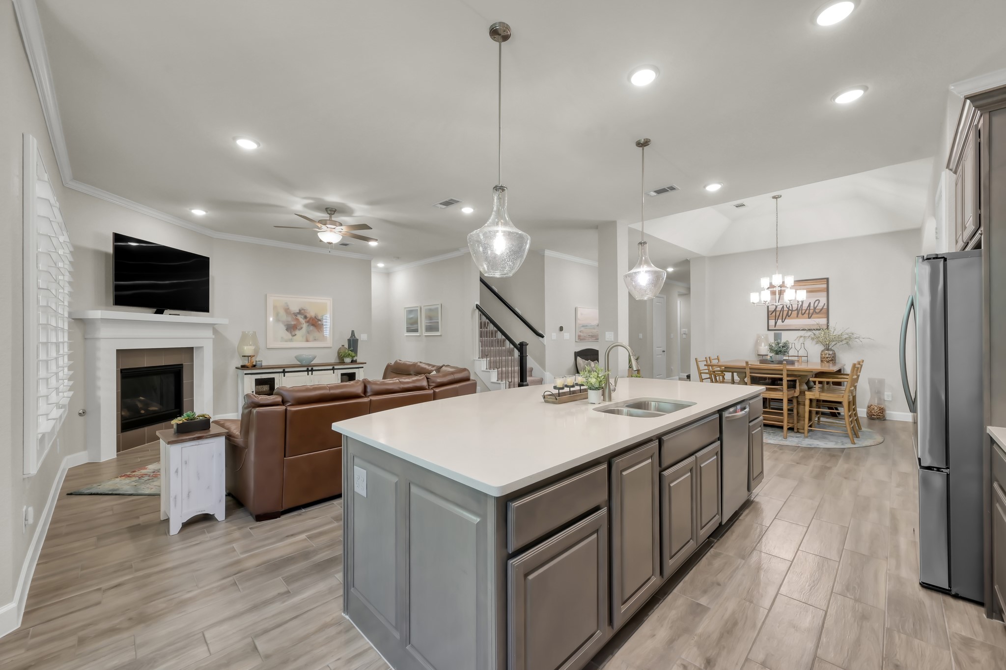 334 Torrey Bloom Loop Conroe, TX 77304 - Photo 21 of 47 Open-concept living with seamless flow from kitchen to family room.