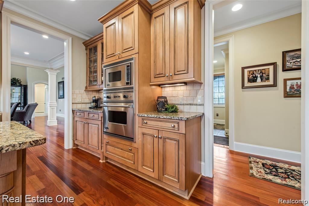 7500 Maple Ridge Drive Clarkston, MI 48346 - Photo 27 of 75 Built in electric oven, undercabinet lighting for that special touch, Brazilian cherry flooring