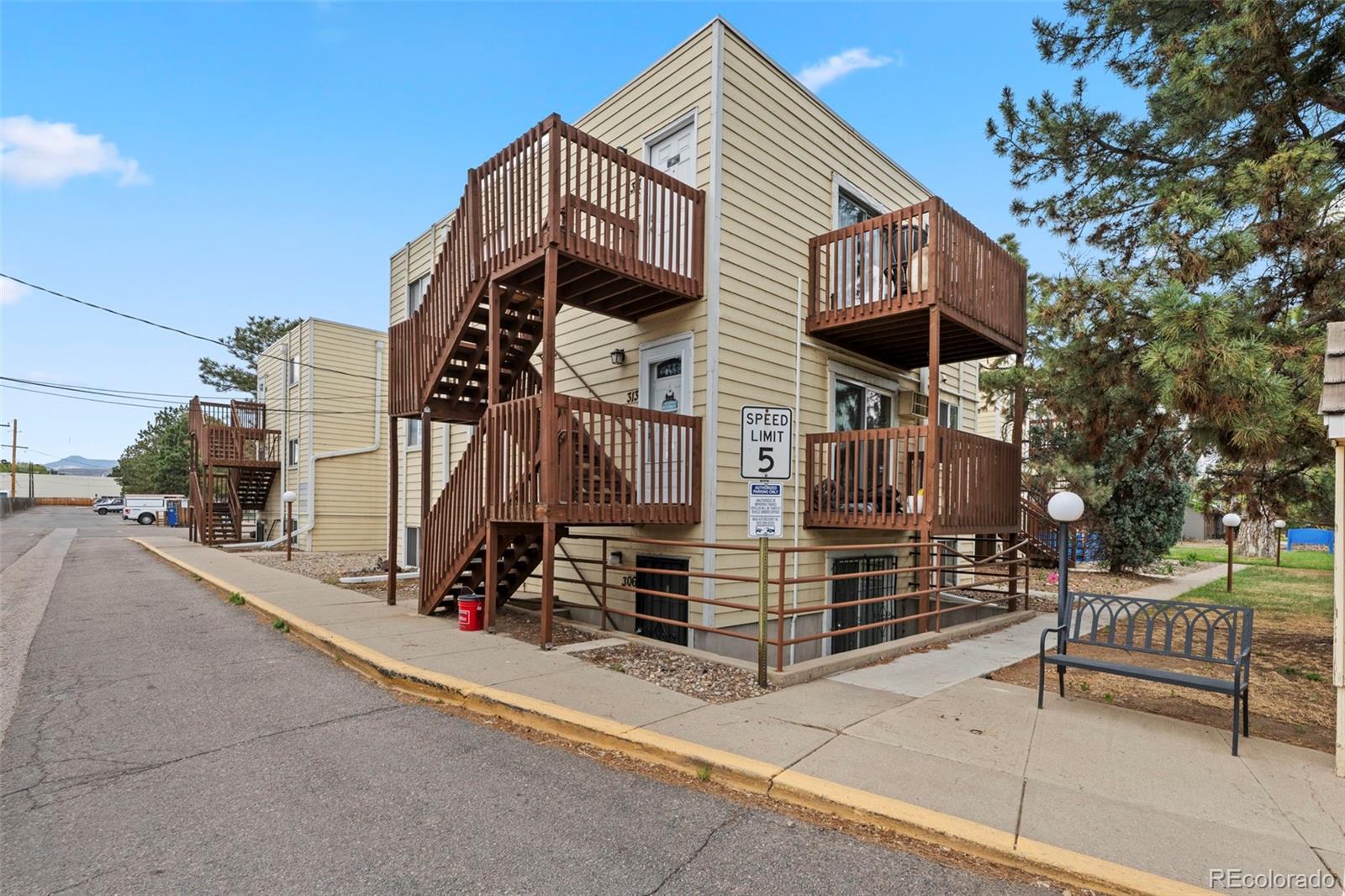 9240 West 49th Avenue, Unit 306 Wheat Ridge, CO 80033 - Photo 12 of 14 a view of a street with sitting area