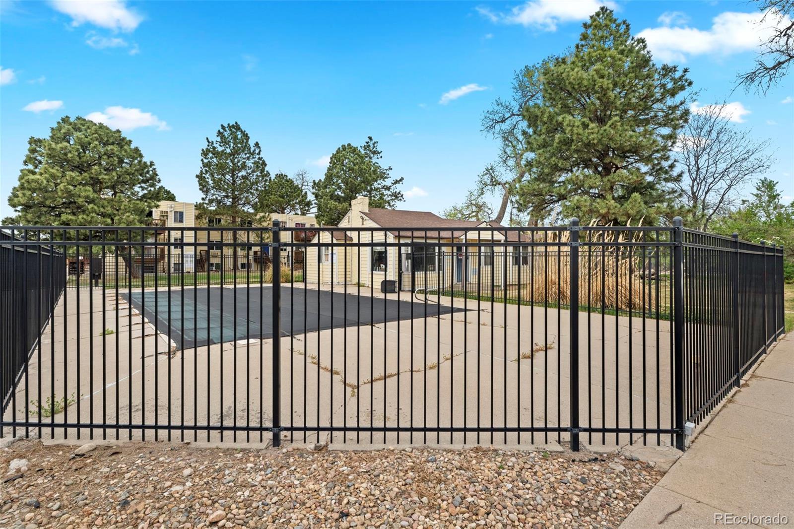 9240 West 49th Avenue, Unit 306 Wheat Ridge, CO 80033 - Photo 13 of 14 a view of a black gate