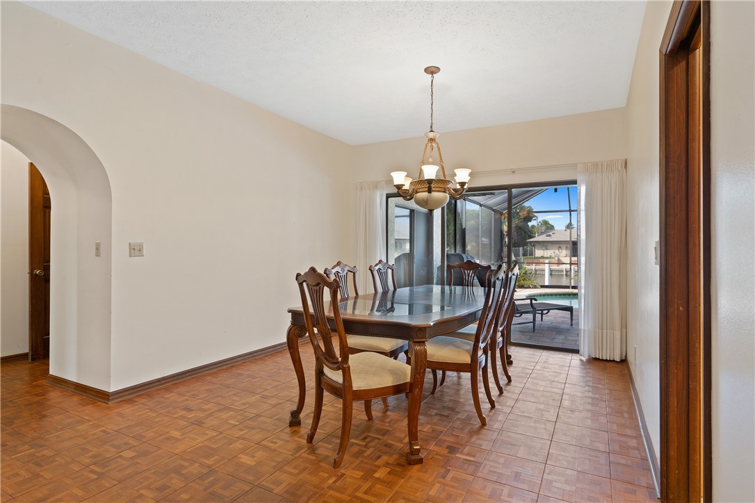 1713 Sunset Isles Road Fort Pierce, FL 34949 - Photo 19 of 36 a dining room with furniture and window