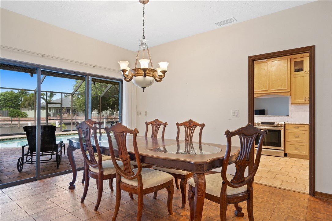 1713 Sunset Isles Road Fort Pierce, FL 34949 - Photo 20 of 36 a view of a dining room with furniture window and outside view