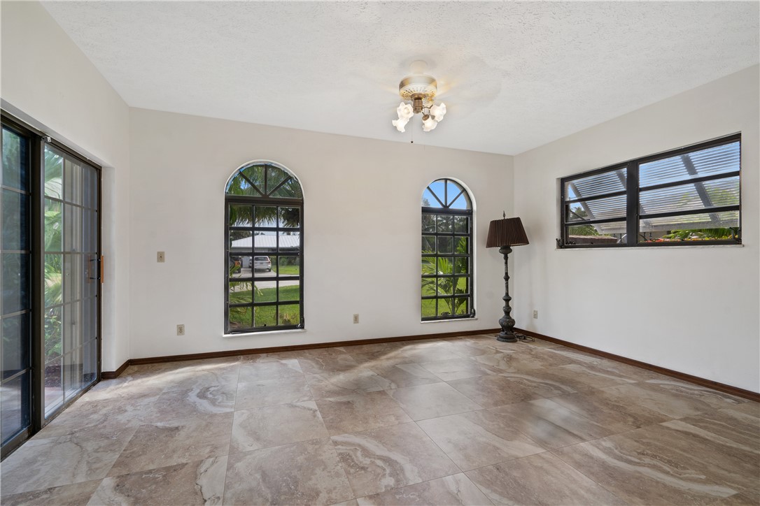 1713 Sunset Isles Road Fort Pierce, FL 34949 - Photo 23 of 36 an empty room with windows