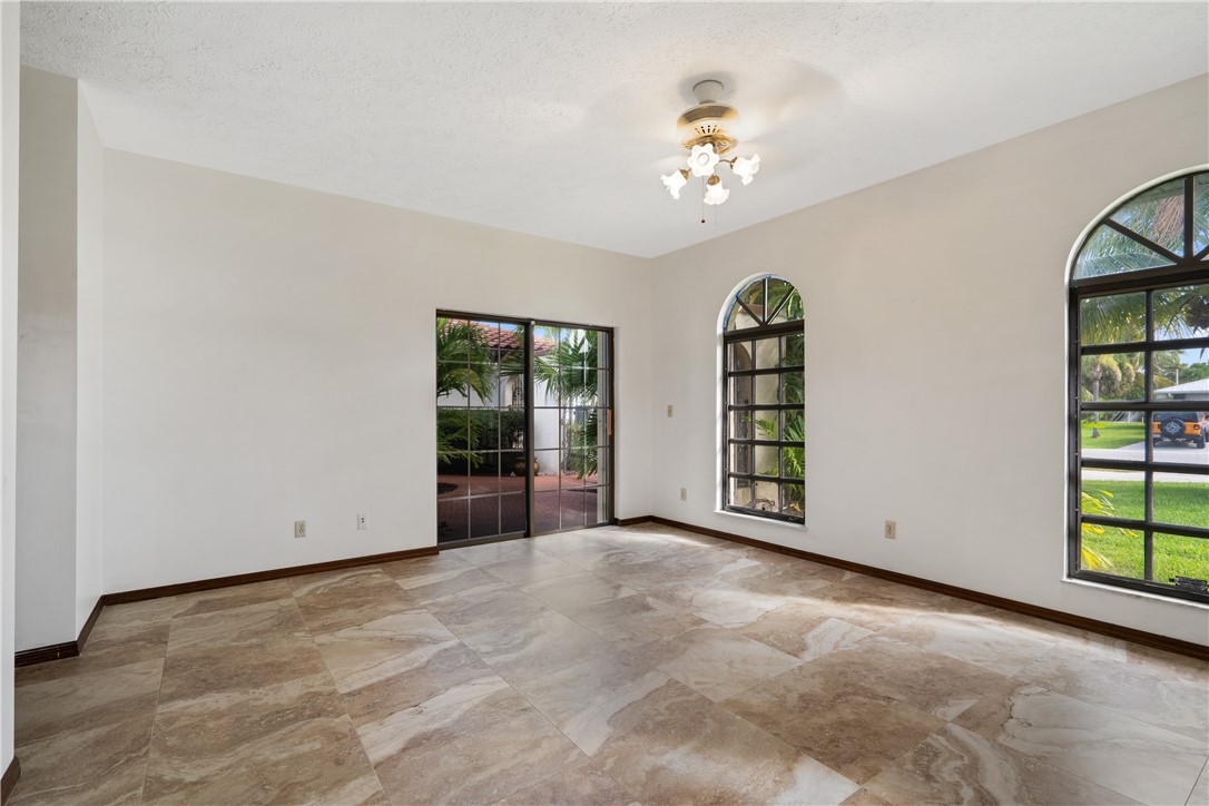 1713 Sunset Isles Road Fort Pierce, FL 34949 - Photo 24 of 36 a view of an empty room with window and cabinet
