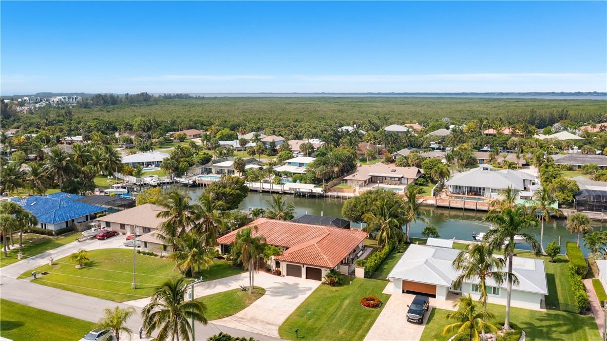 1713 Sunset Isles Road Fort Pierce, FL 34949 - Photo 26 of 36 an aerial view of residential houses with outdoor space