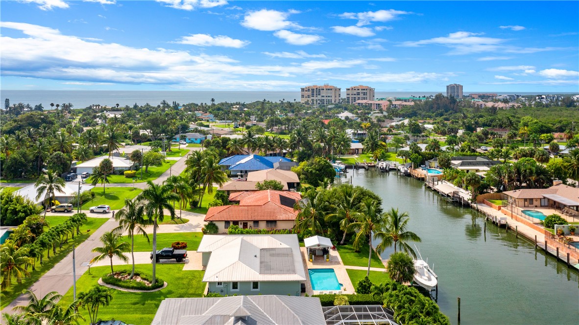 1713 Sunset Isles Road Fort Pierce, FL 34949 - Photo 27 of 36 an aerial view of residential houses with outdoor space and lake view