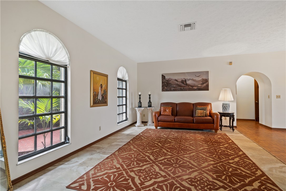 1713 Sunset Isles Road Fort Pierce, FL 34949 - Photo 4 of 36 a living room with furniture and a window