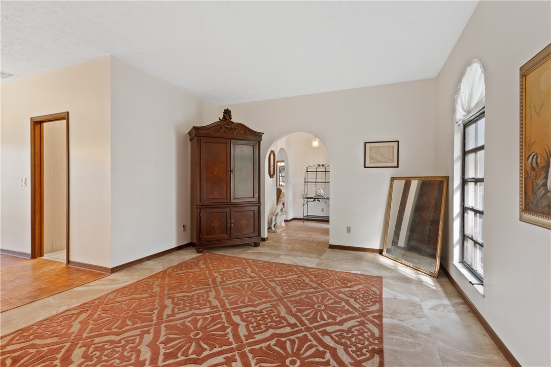 1713 Sunset Isles Road Fort Pierce, FL 34949 - Photo 5 of 36 a view of a bedroom with wooden floor and closet