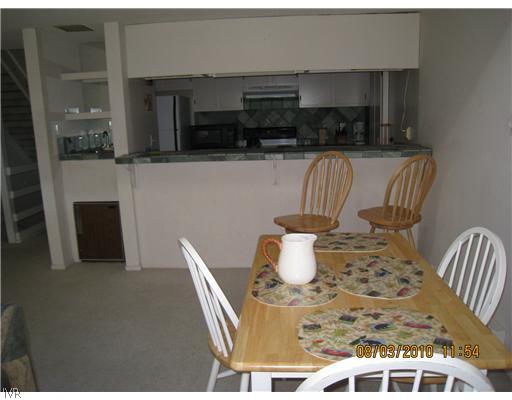 321 Ski Way, Unit 170 Incline Village, NV 89451 - Photo 4 of 8 a view of a dining room with furniture and wooden floor