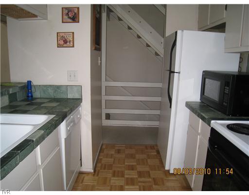 321 Ski Way, Unit 170 Incline Village, NV 89451 - Photo 5 of 8 a kitchen with a sink and a refrigerator