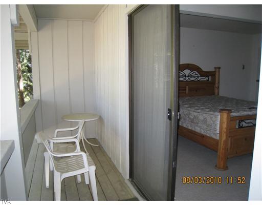 321 Ski Way, Unit 170 Incline Village, NV 89451 - Photo 7 of 8 a bedroom with a bed and a chair