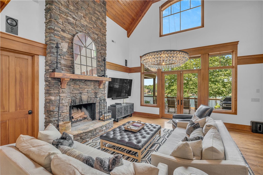 256 Talton Road Six Mile, SC 29682 - Photo 10 of 50 Warm wood accents complement a soaring vaulted ceiling and a floor-to-ceiling stone fireplace.