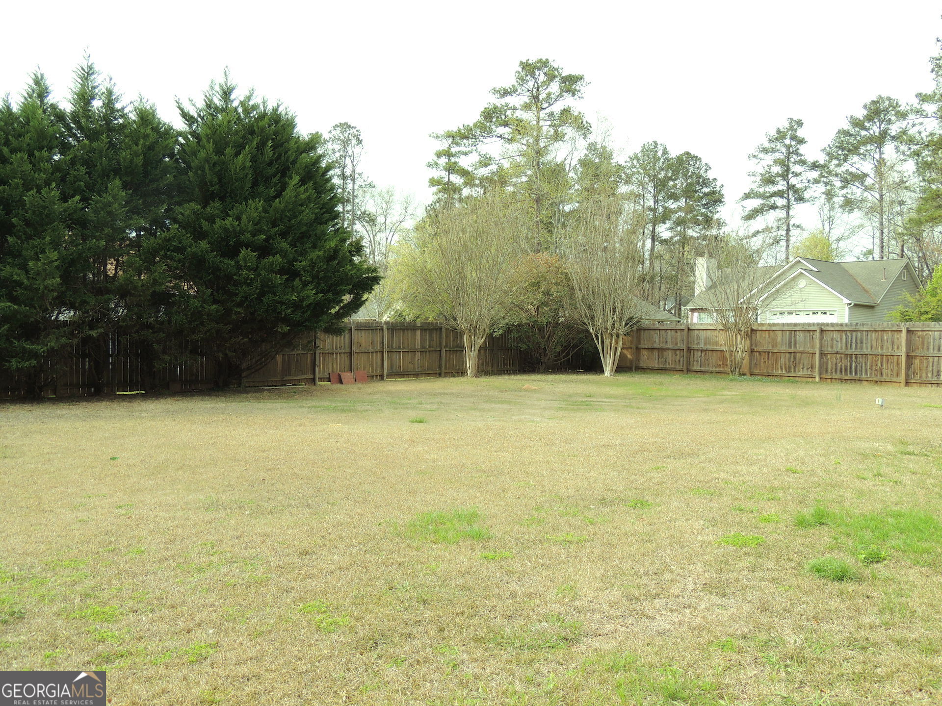 10 Brandon Drive Covington, GA 30016 - Photo 12 of 13 a swimming pool with an outdoor space and seating area