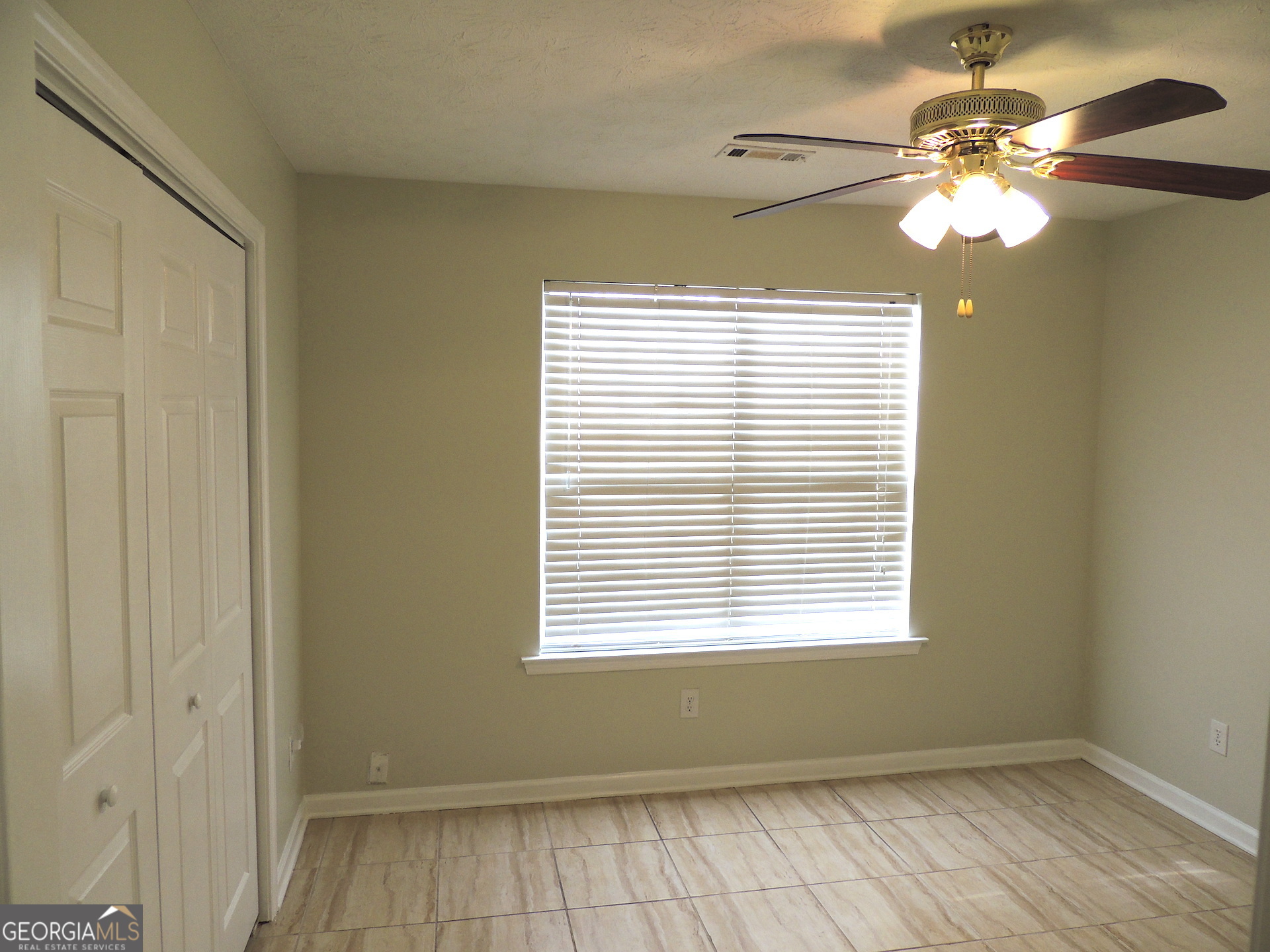 10 Brandon Drive Covington, GA 30016 - Photo 5 of 13 a view of a room with windows