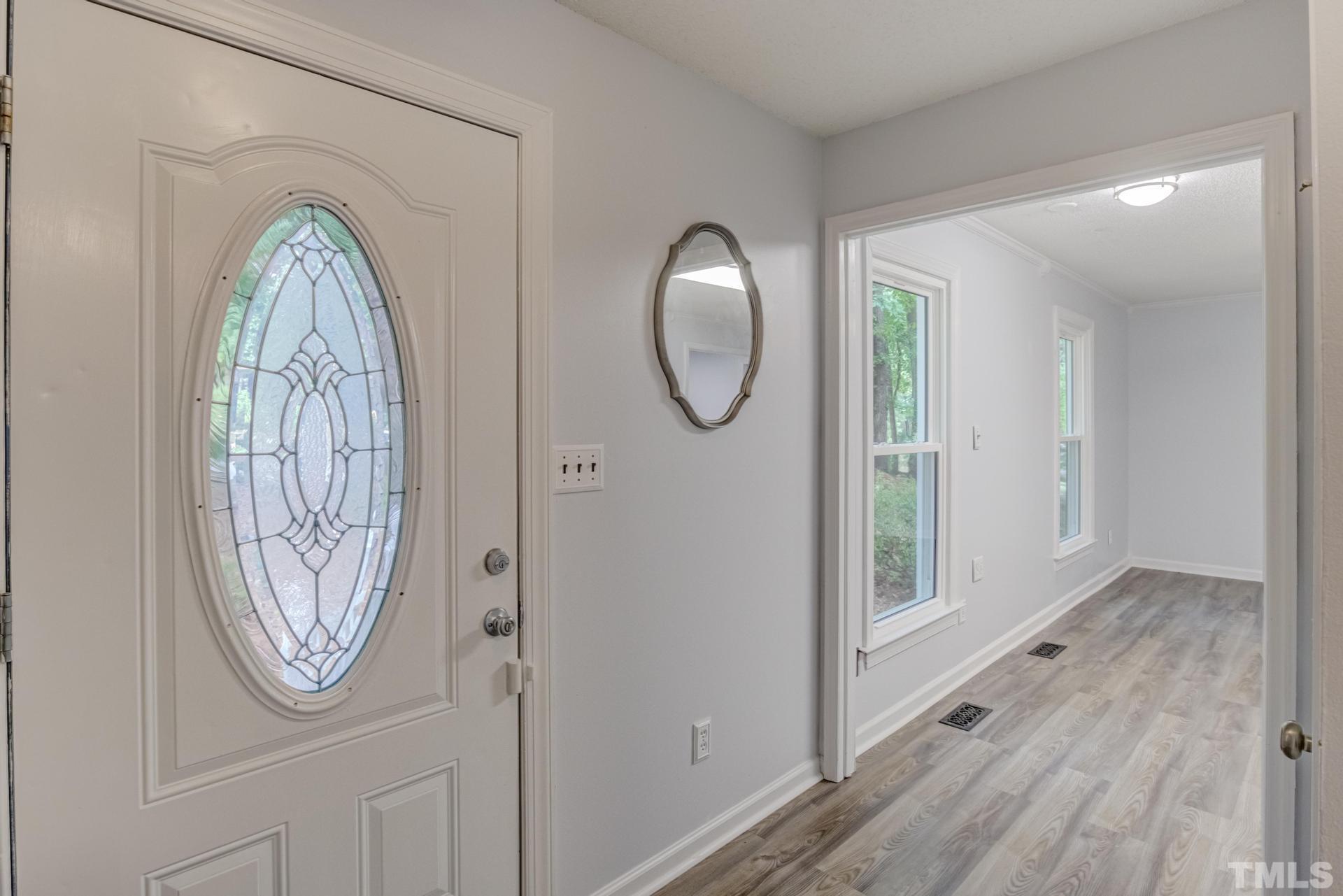 1416 Princess Anne Road Cary, NC 27513 - Photo 8 of 58 a view of a livingroom with wooden floor