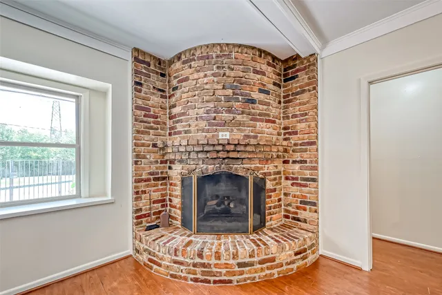 a view of fireplace and wooden floor