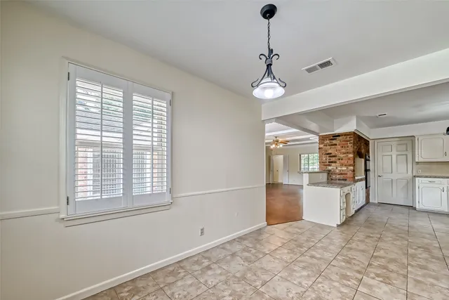 a view of a kitchen with a sink and microwave