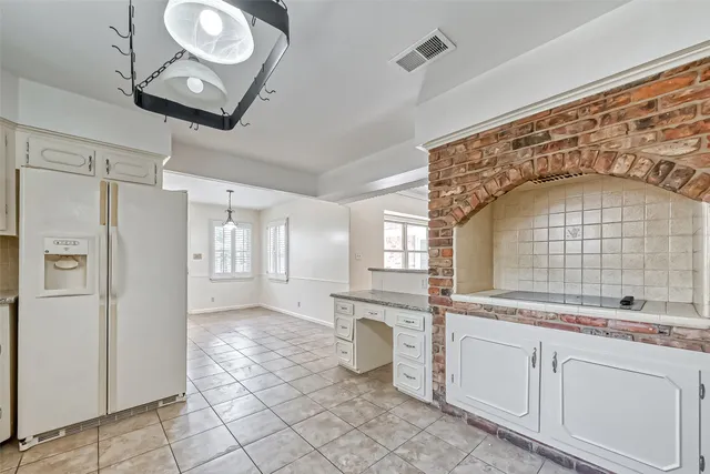 a bathroom with a sink mirror and shower