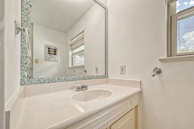 a bathroom with a sink and a bathtub