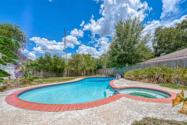 a view of a swimming pool with an outdoor space