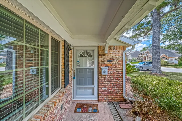a view of entryway with brick walls