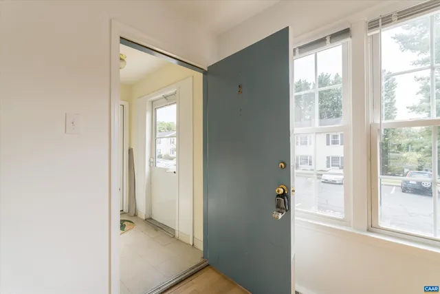 a view of entryway with wooden floor