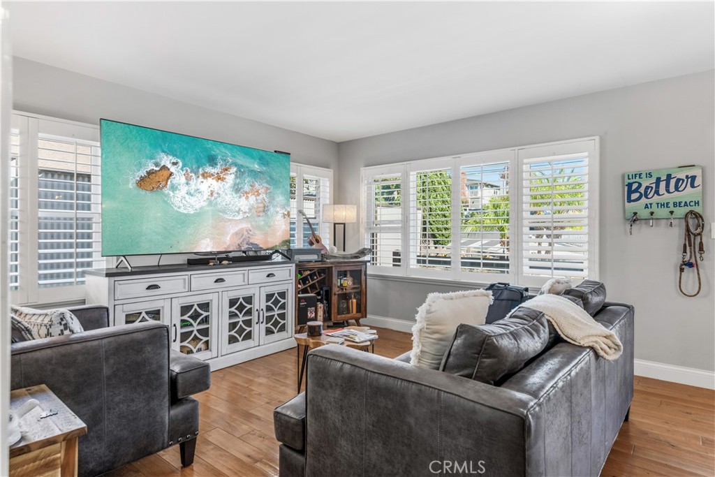 22709 Gaycrest Avenue Torrance, CA 90505 - Photo 3 of 22 a living room with furniture and a flat screen tv