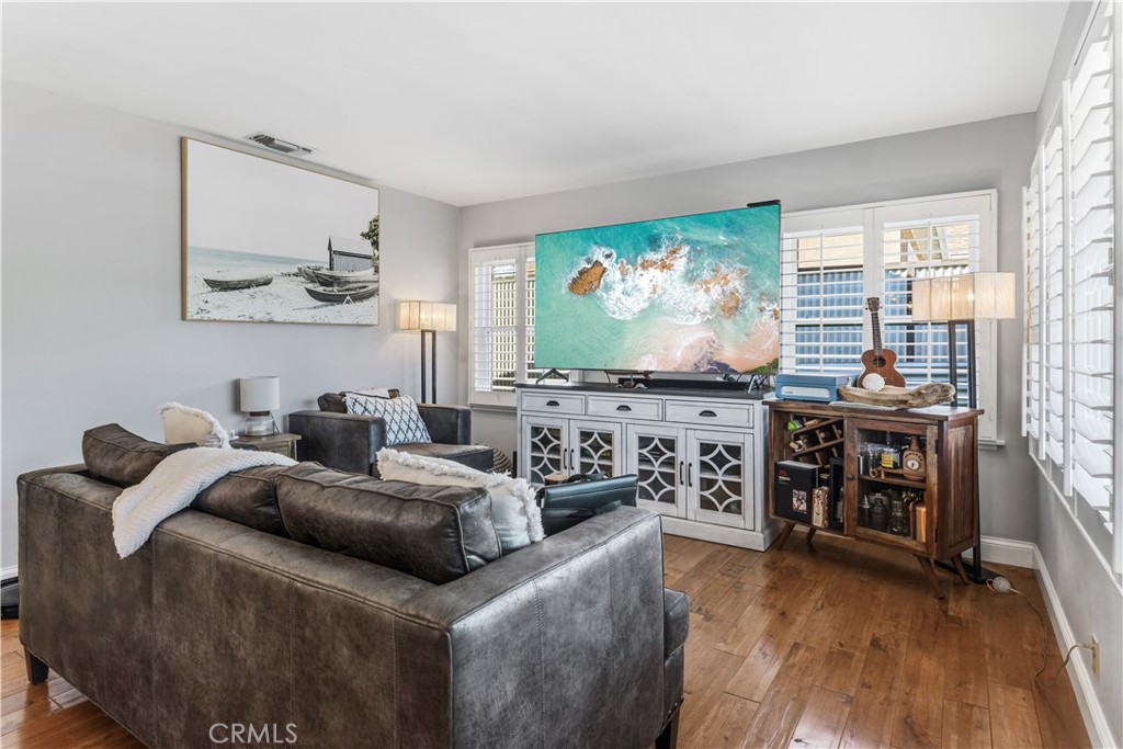 22709 Gaycrest Avenue Torrance, CA 90505 - Photo 4 of 22 a living room with furniture and a flat screen tv