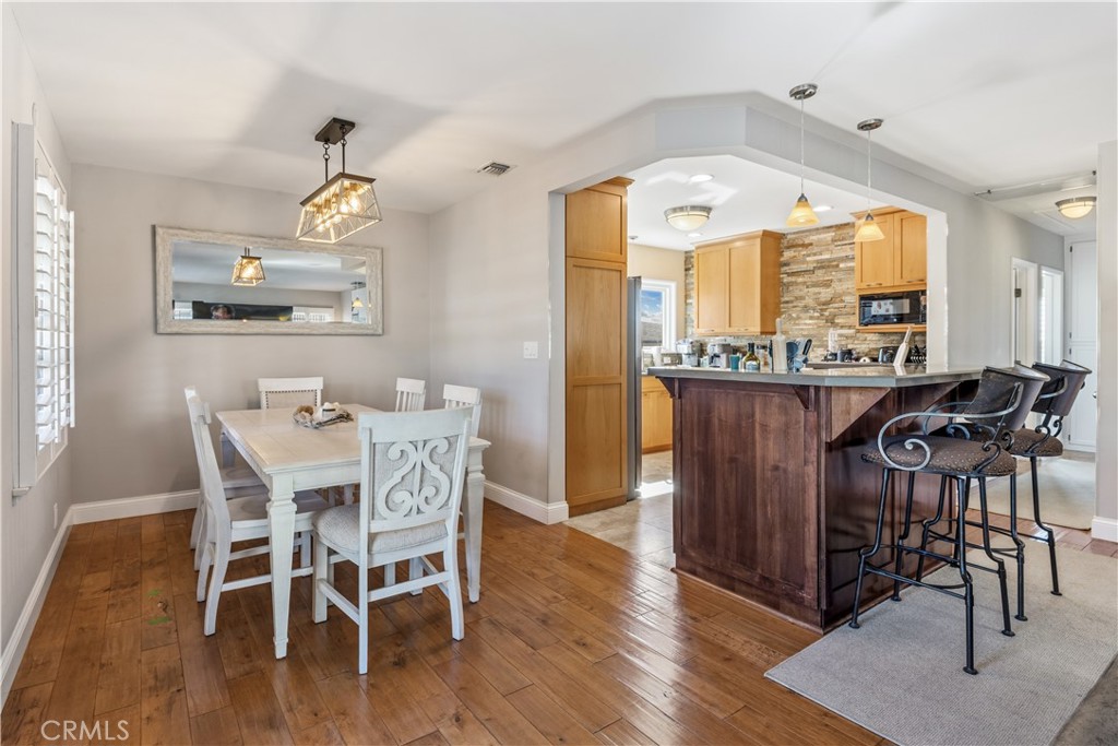 22709 Gaycrest Avenue Torrance, CA 90505 - Photo 7 of 22 a view of a dining room with furniture window and wooden floor
