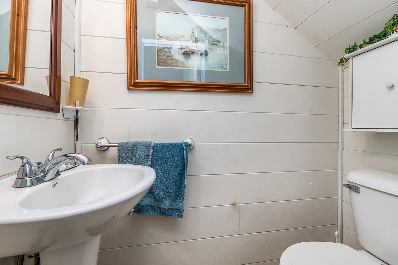 514 3rd Street Galena, IL 61036 - Photo 19 of 25 a bathroom with a sink and a mirror