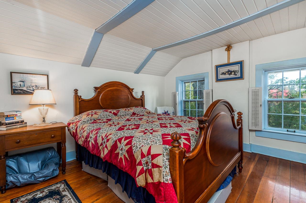 514 3rd Street Galena, IL 61036 - Photo 20 of 25 a bedroom with a bed and a window