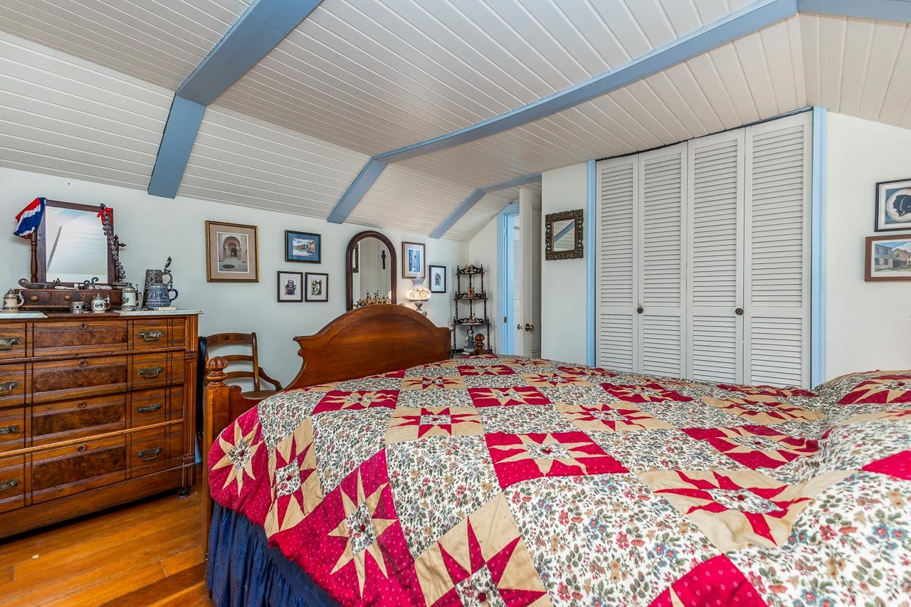 514 3rd Street Galena, IL 61036 - Photo 21 of 25 a bedroom with a bed and a dresser