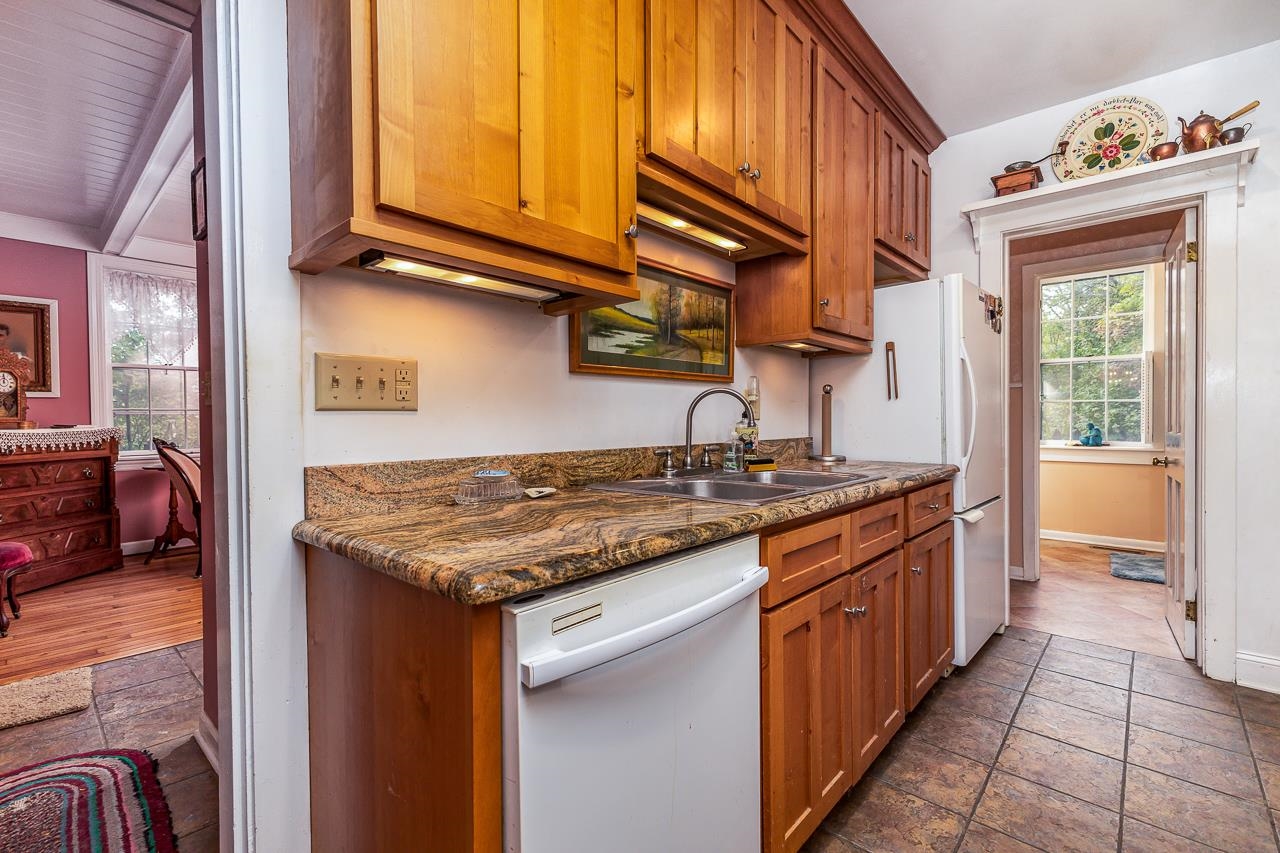514 3rd Street Galena, IL 61036 - Photo 6 of 25 a kitchen with stainless steel appliances granite countertop a stove and a sink