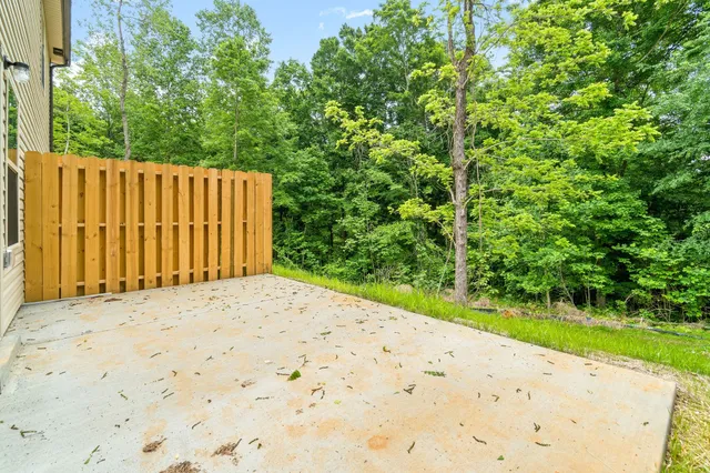 a wooden view of small space with a small yard