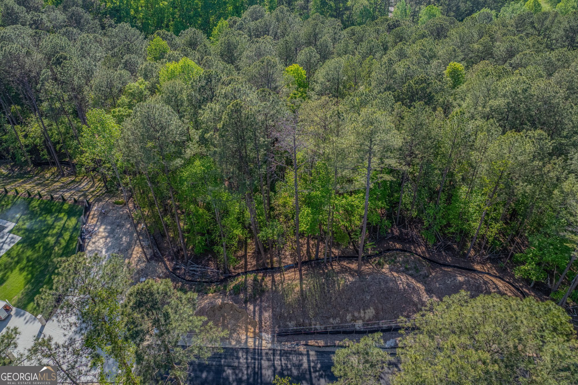1559 Whitley Road Dacula, GA 30019 - Photo 20 of 33 an aerial view of a house with a yard and large trees