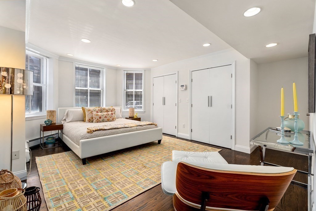 352 Commonwealth Avenue, Unit 2 Boston, MA 02115 - Photo 12 of 25 a living room with furniture and a potted plant