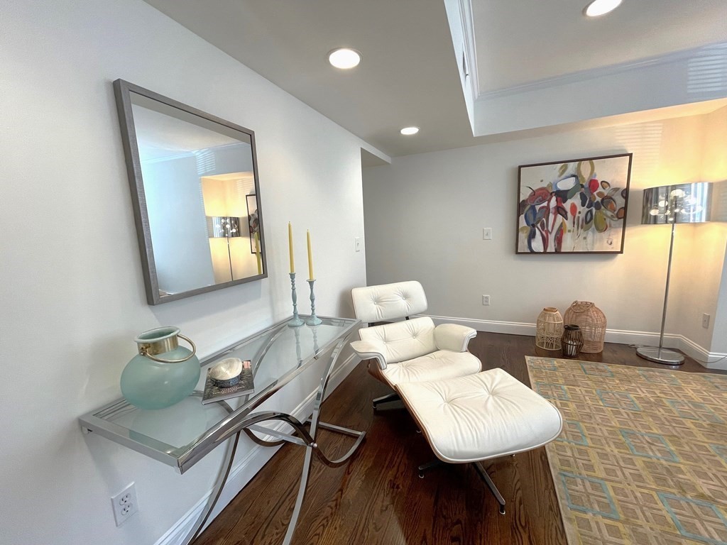 352 Commonwealth Avenue, Unit 2 Boston, MA 02115 - Photo 13 of 25 a view of a workspace with furniture and wooden floor