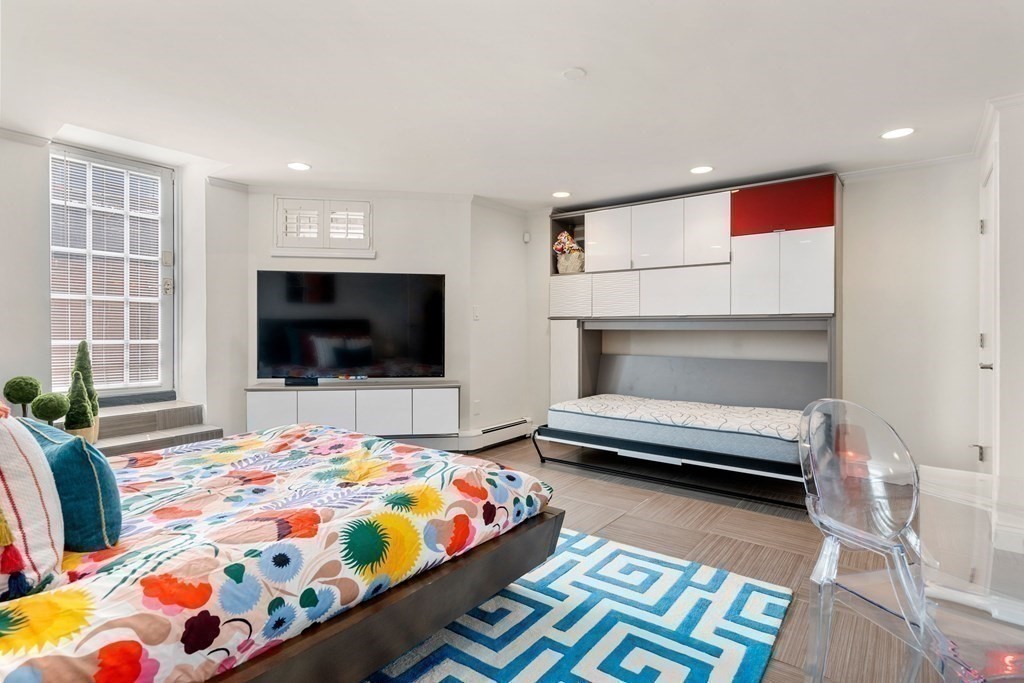 352 Commonwealth Avenue, Unit 2 Boston, MA 02115 - Photo 16 of 25 a bedroom with a bed and a flat screen tv